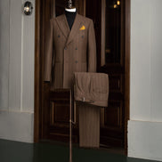 Elegant brown pinstripe suit for men with double-breasted jacket and long extension adjusters. Perfect for high-end formal occasions, crafted sustainably.