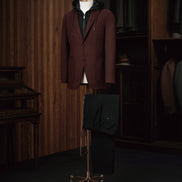 Men's burgundy casual blazer paired with black drawstring pants, elegantly styled with a black hoodie for a refined yet relaxed look. Ideal for fashion-forward individuals seeking a blend of sophistication and comfort. Crafted from sustainable materials for eco-conscious style.