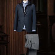 Elegant navy blazer paired with tailored grey trousers, crafted for a sophisticated high-end look. Sustainable materials and expert tailoring, perfect for formal occasions.
