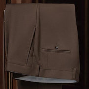 Close-up of brown khaki trousers showcasing fine tailoring, back pocket detail, and sustainable fabric, ideal for a sophisticated and eco-conscious formal look.