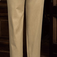 Close-up of tailored beige chinos, showcasing fine craftsmanship and sustainable fabric, perfect for a refined and eco-friendly formal ensemble.
