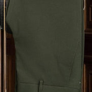 Close-up of olive tailored trousers, highlighting the elegant fabric and refined tailoring, ideal for pairing with high-end jackets for formal occasions.
