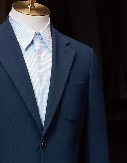 Detailed view of peak lapels and chest pocket on a classic navy suit jacket, showcasing fine tailoring and luxury fabric for a refined and sustainable style.