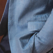 Close-up of expertly crafted buttons and pockets on a Coastal Breeze Blazer, designed for men seeking high-end, sustainable formalwear with a touch of sophistication