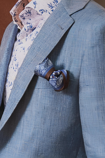 Detailed view of peak lapels and chest pocket on a coastal breeze blazer, showcasing fine tailoring and luxury fabric for a refined and sustainable style.