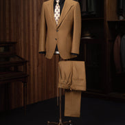 Luxurious dark beige tailored suit, designed for a high-end look at formal events. Crafted with eco-friendly, sustainable materials, this stylish men's outfit combines sophistication and comfort, perfect for refined fashion enthusiasts.