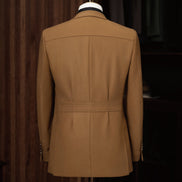 An elegant dark beige suit jacket viewed from the back, featuring a safari-inspired design that combines luxury tailoring with sustainability, ideal for women seeking refined formal wear.