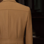  Showcasing the structured safari back of the beige suit jacket, this view highlights the elegant stitching and eco-conscious fabric choice, suitable for women who appreciate high-end tailored clothing.