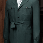 A close-up of the suit jacket's flap pockets and peak lapels, showcasing the meticulous tailoring and classic style ideal for high-end formal occasions.