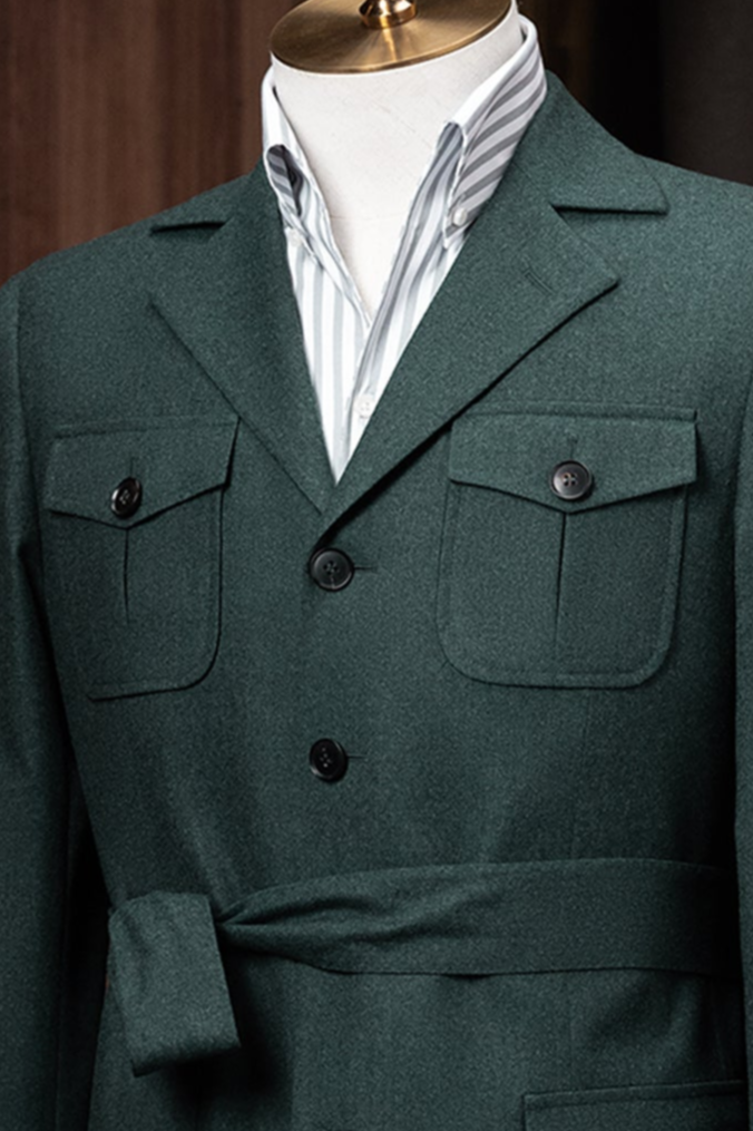 A close-up of the jacket’s chest pockets with button detailing, demonstrating elegant craftsmanship and sustainable tailoring perfect for discerning customers.