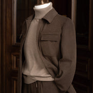Modern earthy brown jacket with matching tailored cargos. Close up on collar and pocket details, Perfect for high-end formal occasions, crafted 