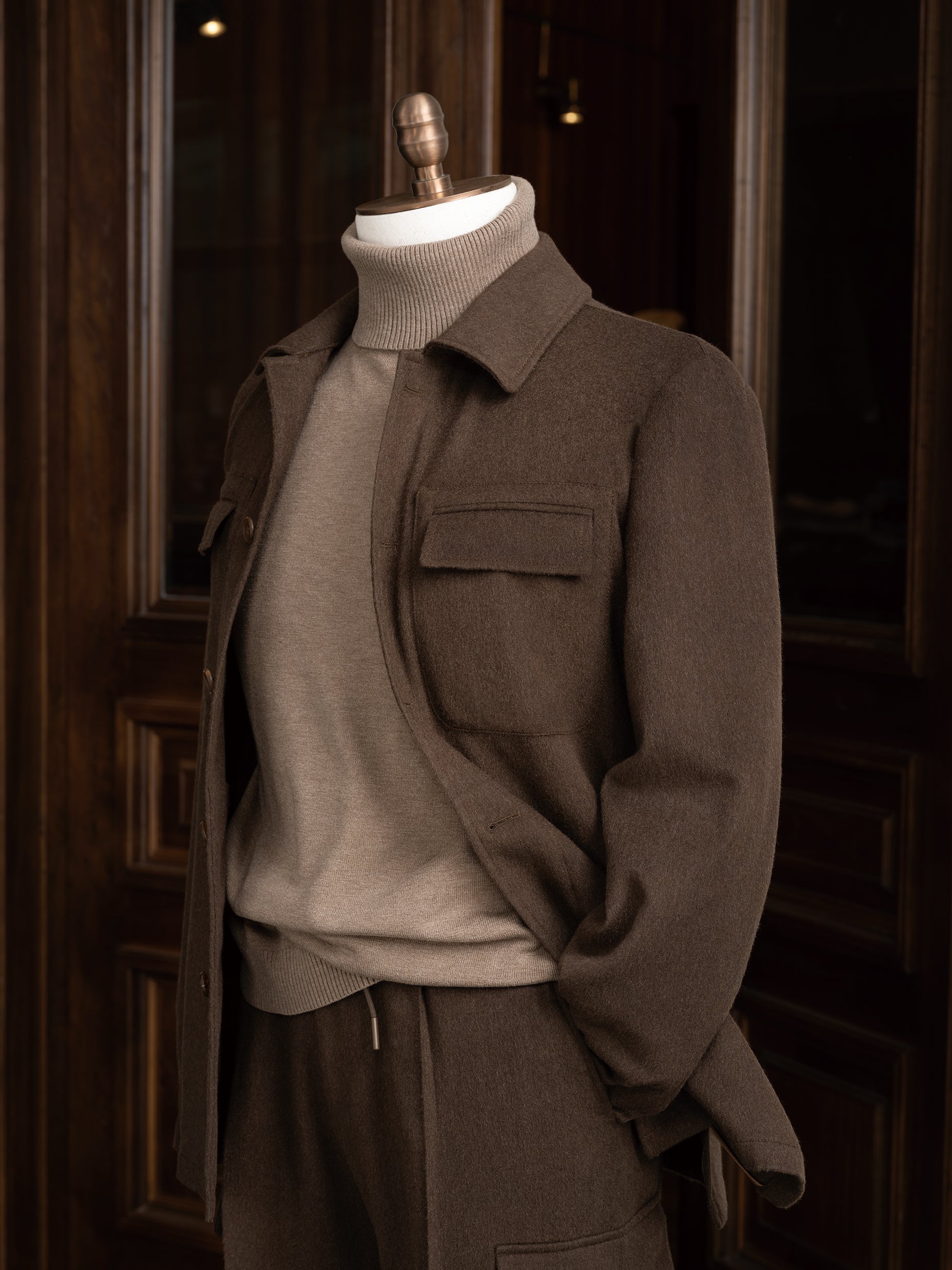 Modern earthy brown jacket with matching tailored cargos. Close up on collar and pocket details, Perfect for high-end formal occasions, crafted 