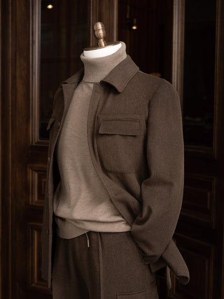 Modern earthy brown jacket with matching tailored cargos. Close up on collar and pocket details, Perfect for high-end formal occasions, crafted 