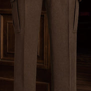 Close-up of earthy brown tailored cargos, showcasing fine craftsmanship and sophisticated detailing, ideal for formal wear.