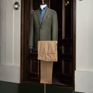Complete look featuring a green checked jacket paired with beige tailored trousers, designed for elegance and versatility in any formal setting.