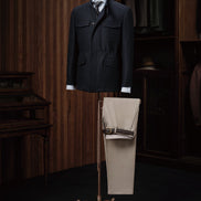 A versatile navy utility jacket paired with beige trousers, ideal for a smart casual look.