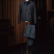 A sophisticated navy wool overshirt paired with navy trousers, perfect for a seamless and elegant look.